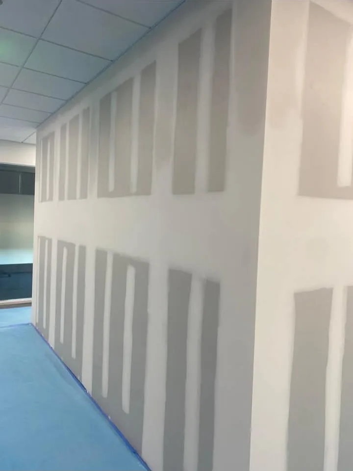 Long commercial hallway boarded and joints filled