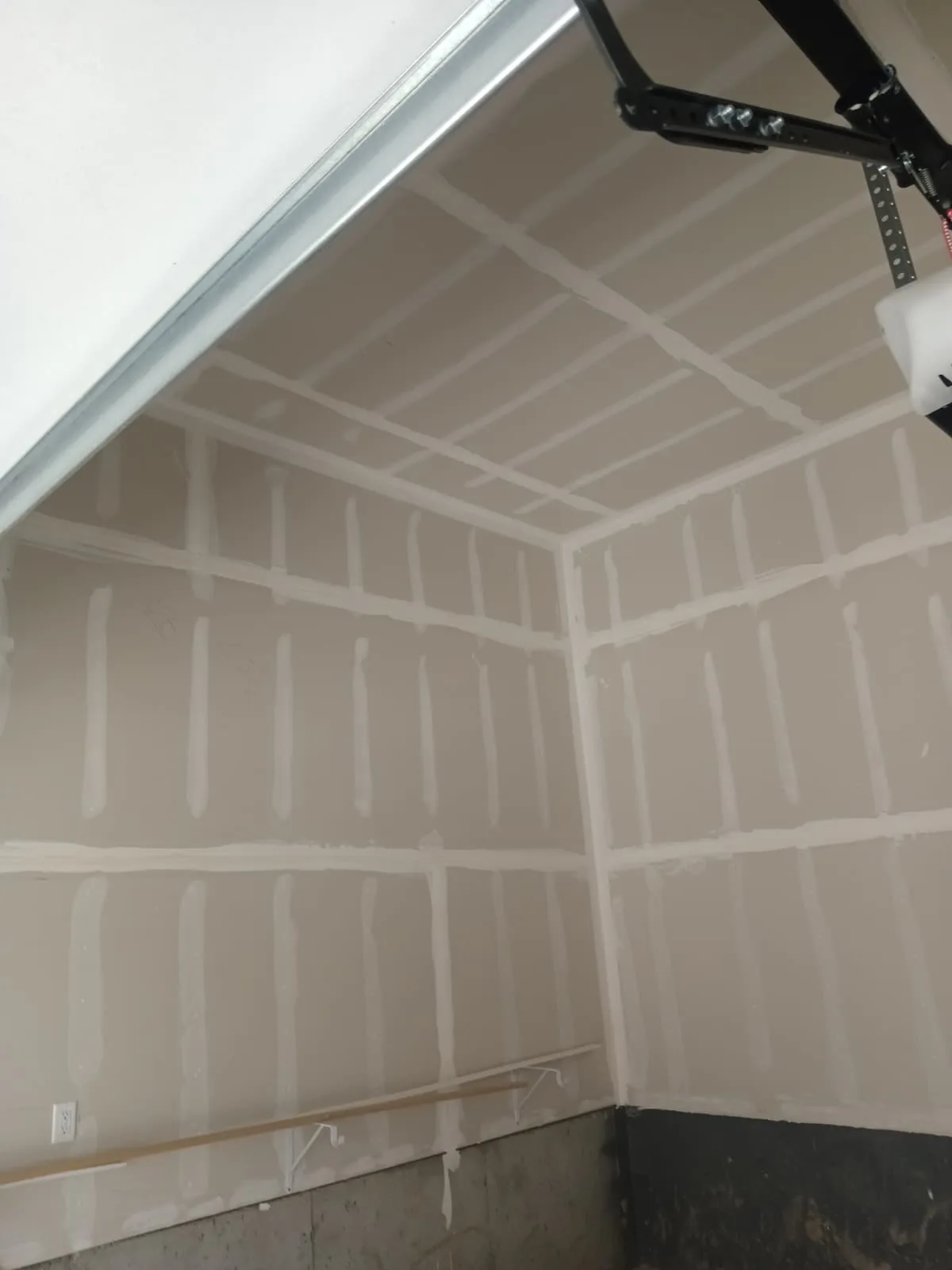 Garage corner boarded out square to the ceiling